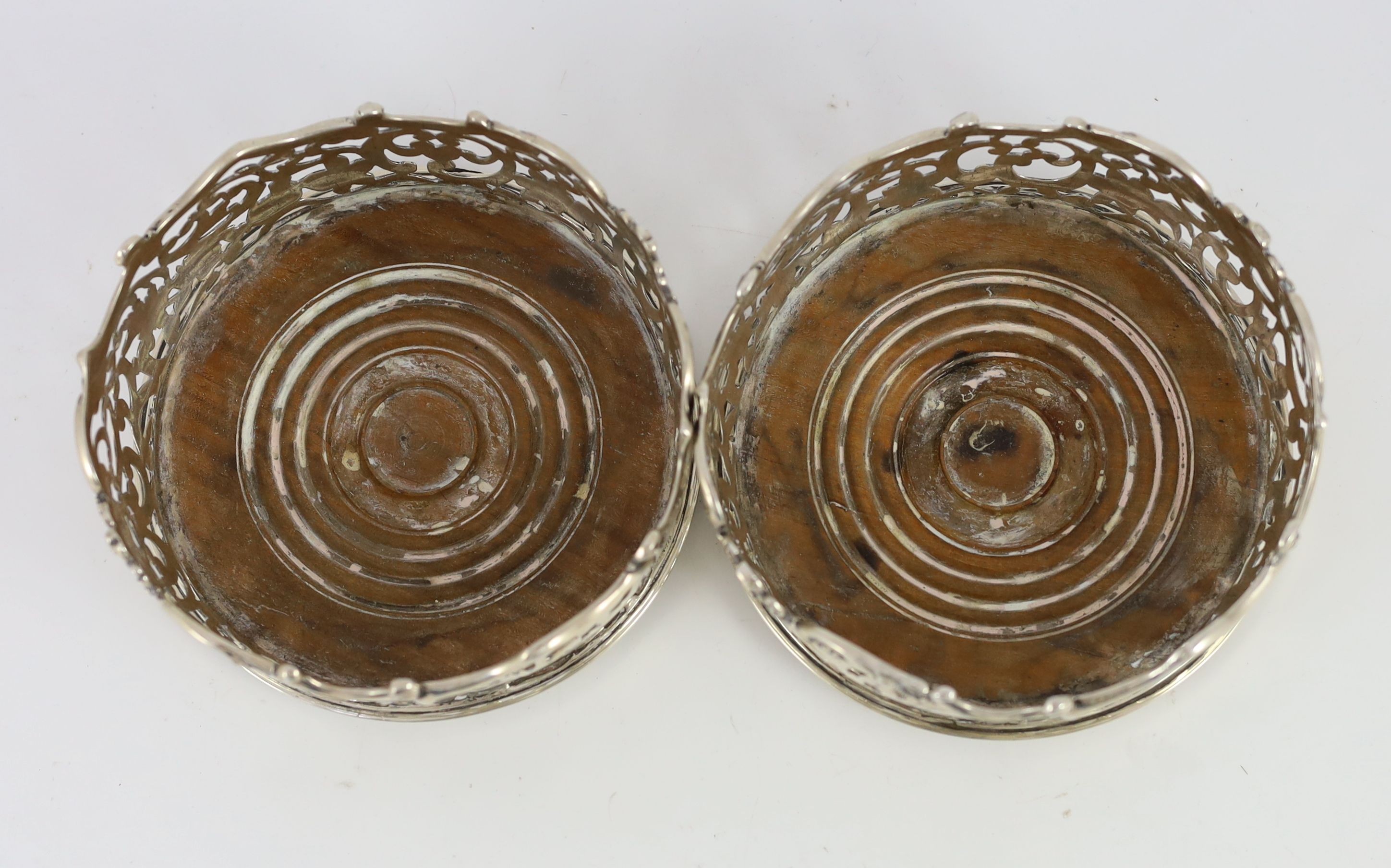 A pair of early Victorian pierced silver mounted wine coasters, by Joseph & Joseph Angell